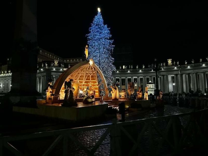 The illuminated nativity scene during the Pope Francis mass on Christmas Eve